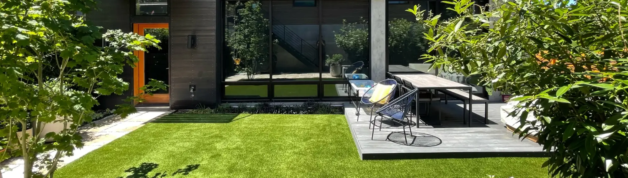 Aerial view of a modern home in Washington state with a large synthetic grass yard