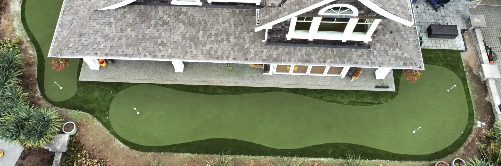 aerial mage of putting green around house