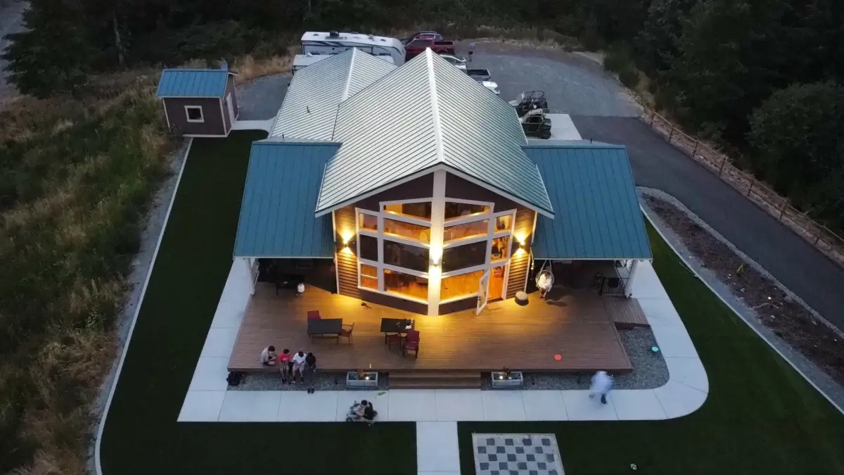 Beautiful synthetic turf backyard installation at sunset showing quality landscaping design in Tacoma Pierce County