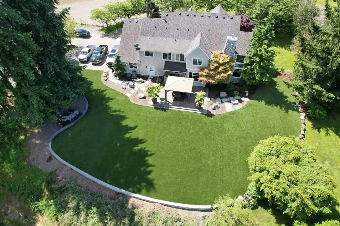 Aerial shot of a large synthetic turf backyard in Maple Valley