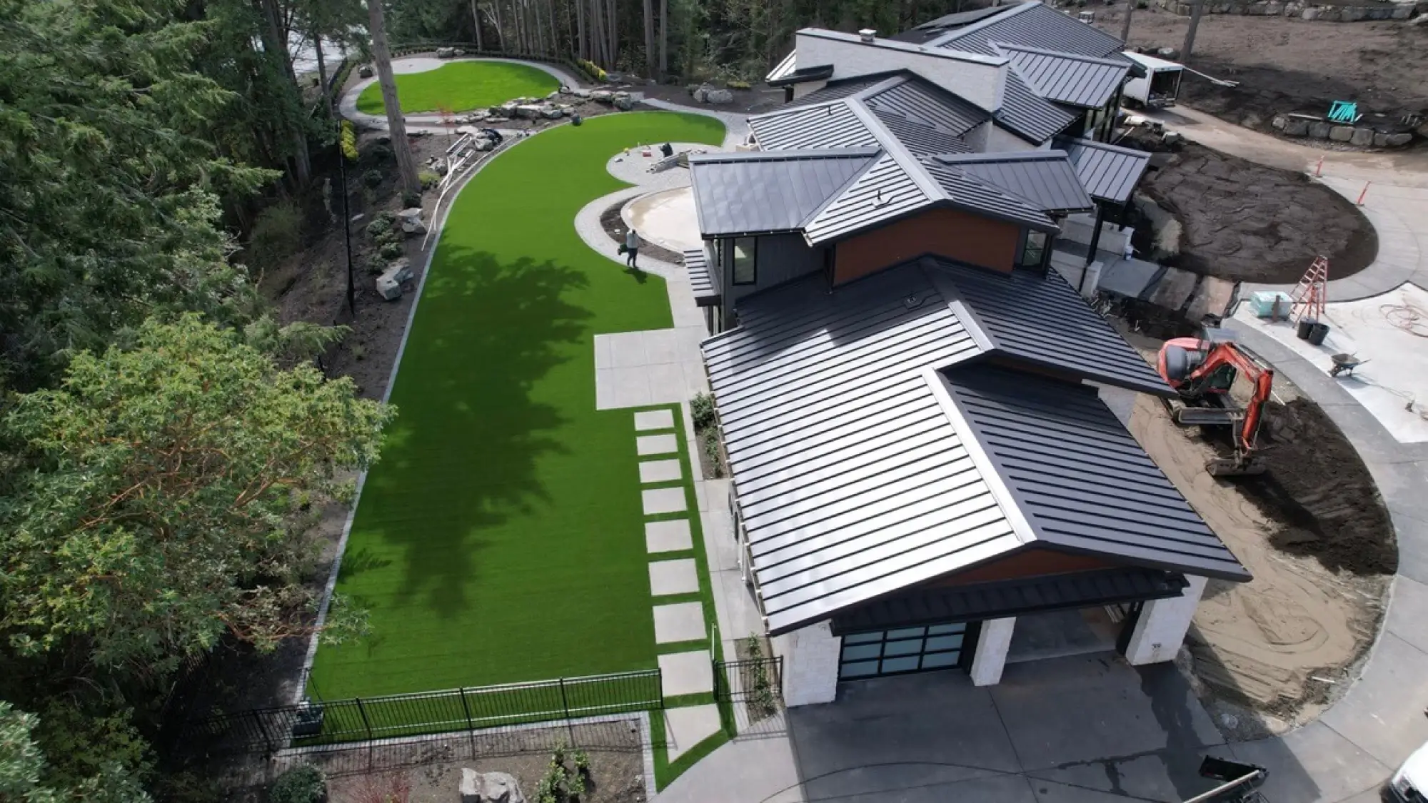Aerial view of large-scale artificial turf installation in Gig Harbor showing invisible professional seam work