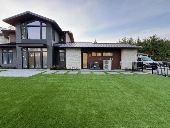 Pavers and synthetic turf installed in large backyard for pets in Gig Harbor