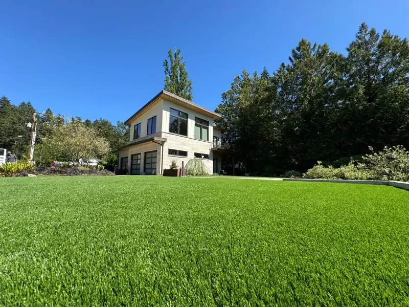 Pristine synthetic turf lawn installation next to golf course in Gig Harbor, Washington State showcasing professional landscaping