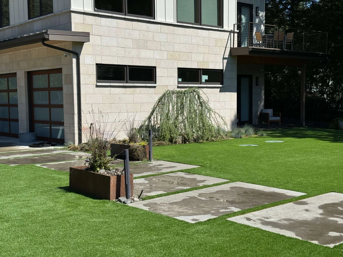 Artificial grass backyard installed with modern landscaping in Gig Harbor